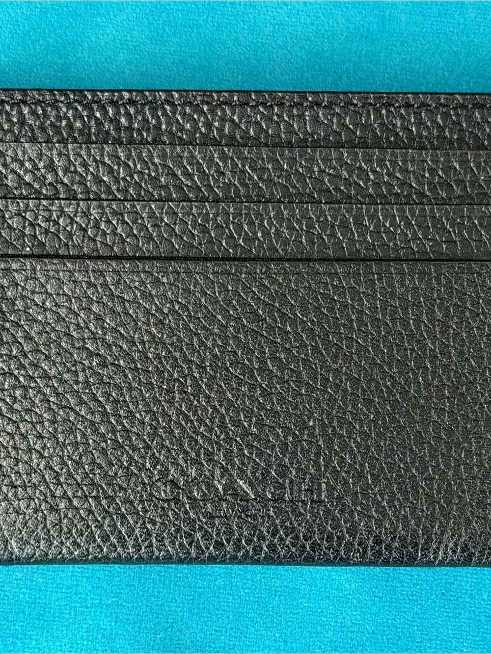Coach sleek black